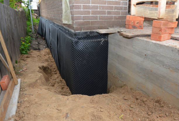 SJ Waterproofing Pros technician performing targeted Waterproofing assessment in Scottsville, KY